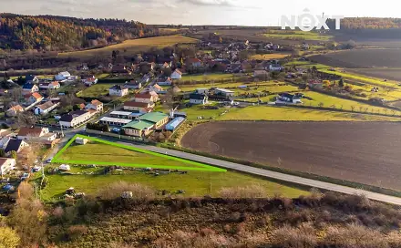 Prodej stavebního pozemku 1 672 m², Příčina