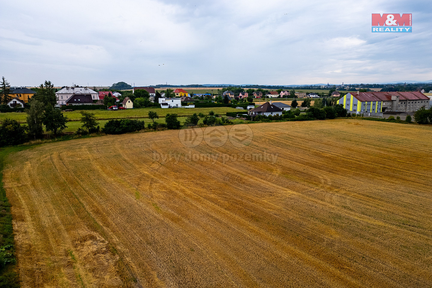 Prodej stavebního pozemku 6 975 m² – pohled 5