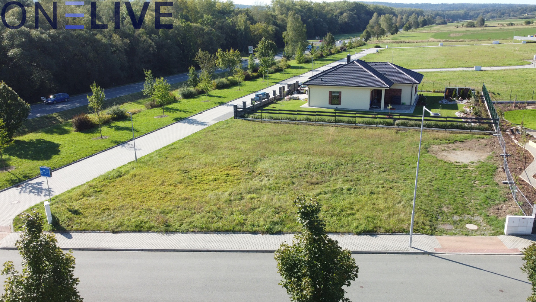 Prodej stavebního pozemku 877 m² – pohled 3
